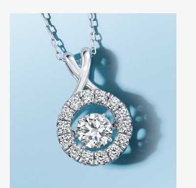White gold pendant necklace with round center diamond and halo of smaller diamonds.