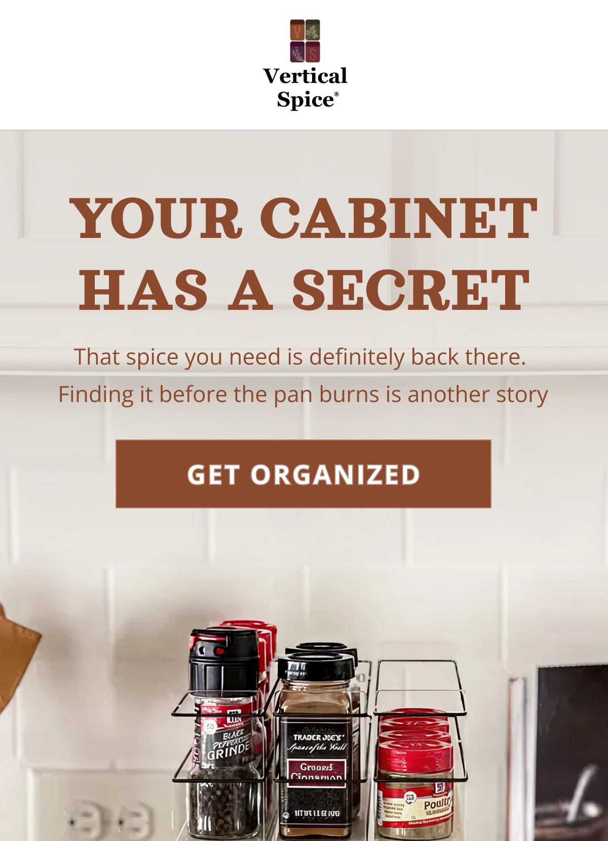 Pull-out spice rack drawer organizer in kitchen cabinet with labeled spice jars, designed to keep spices visible, accessible, and organized while cooking