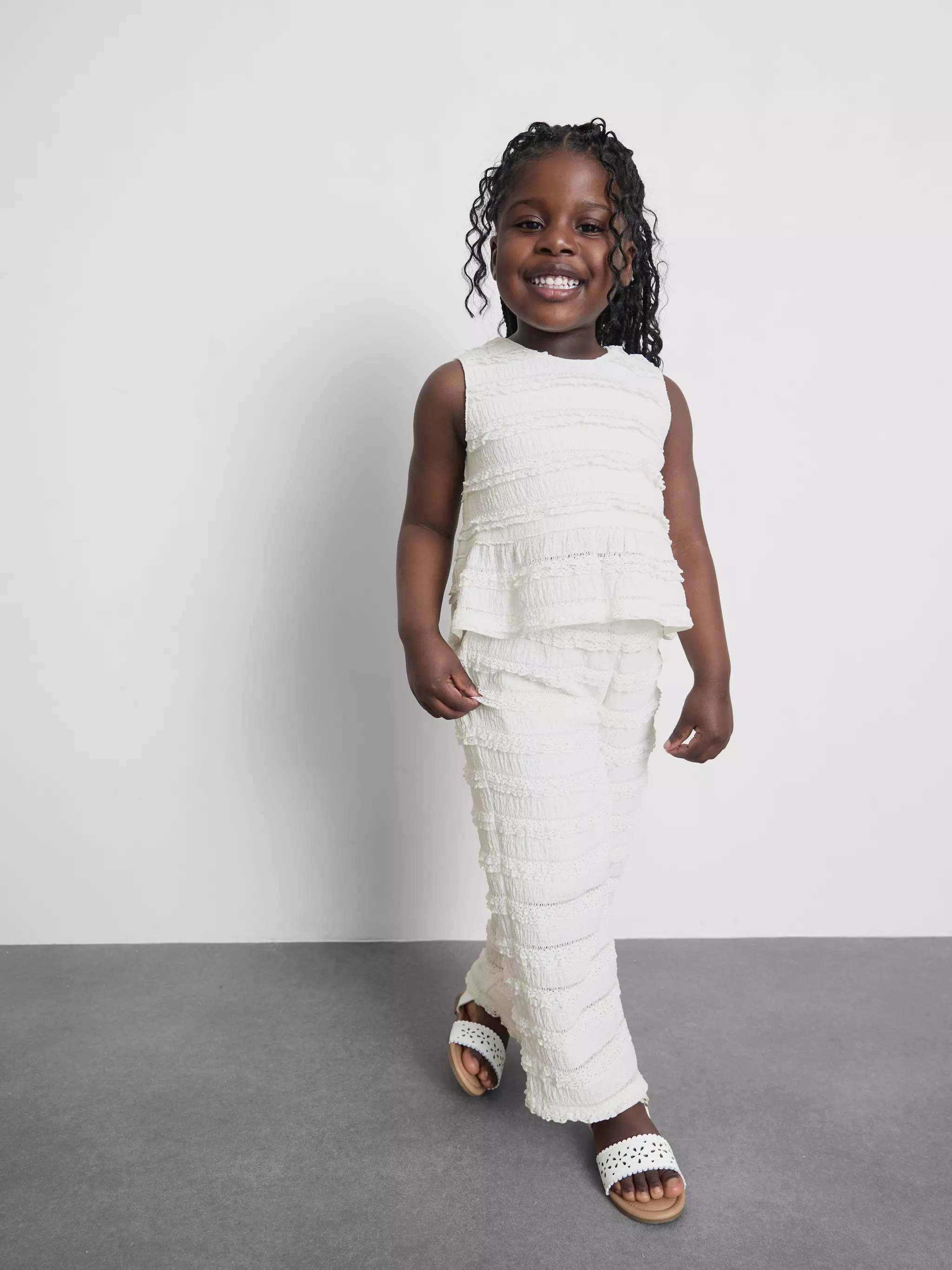 Young girl wearing 1.5-9yrs | Crinkle Textured Ruffle Trousers
