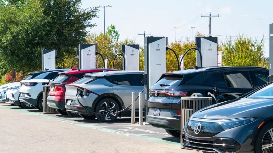 Image depicting electric vehicles charging.