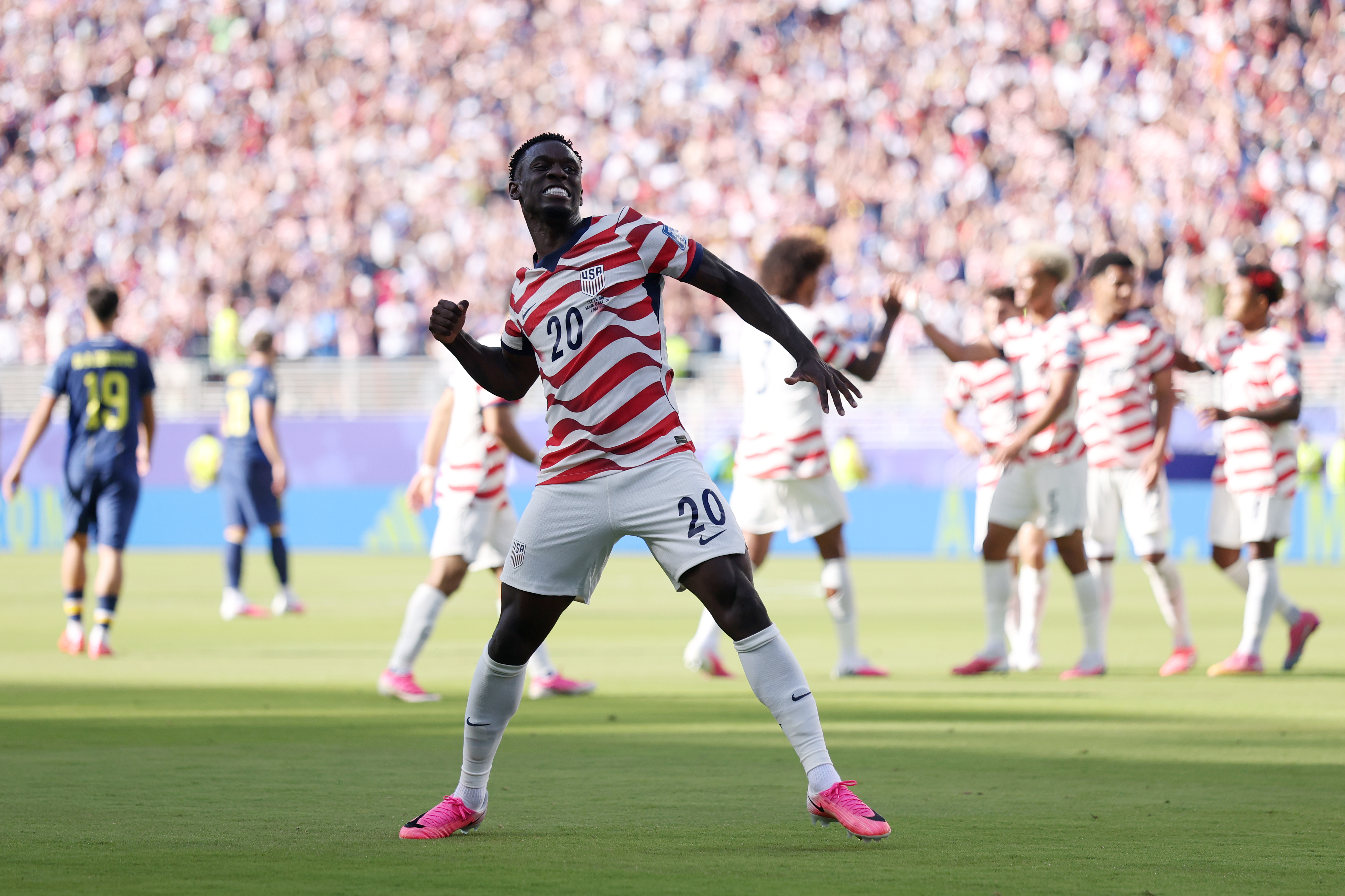 A football player celebrates.