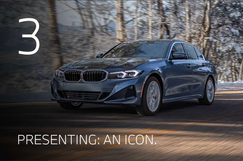 2026 BMW 330i driving down a winter road with snowy trees in the background