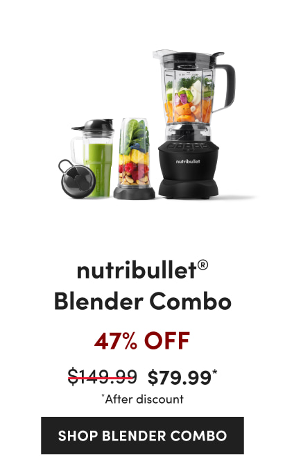 A black nutribullet blender filled with assorted vegetables next to two smaller cups.