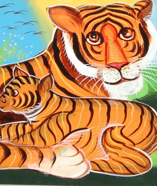 Two illustrated tigers against a blue sky. 