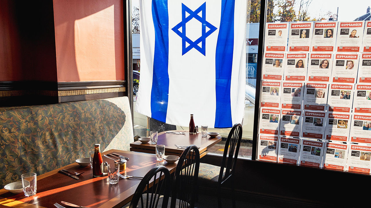 An Israeli flag hangs in the window of a restuarant in Teaneck, New Jersey