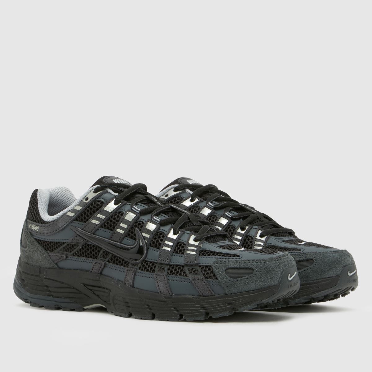 A pair of black Nike trainers