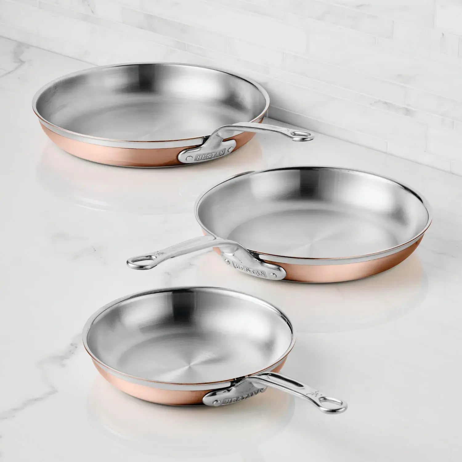 IMG: CopperBond® Copper Induction Skillets on marble countertop