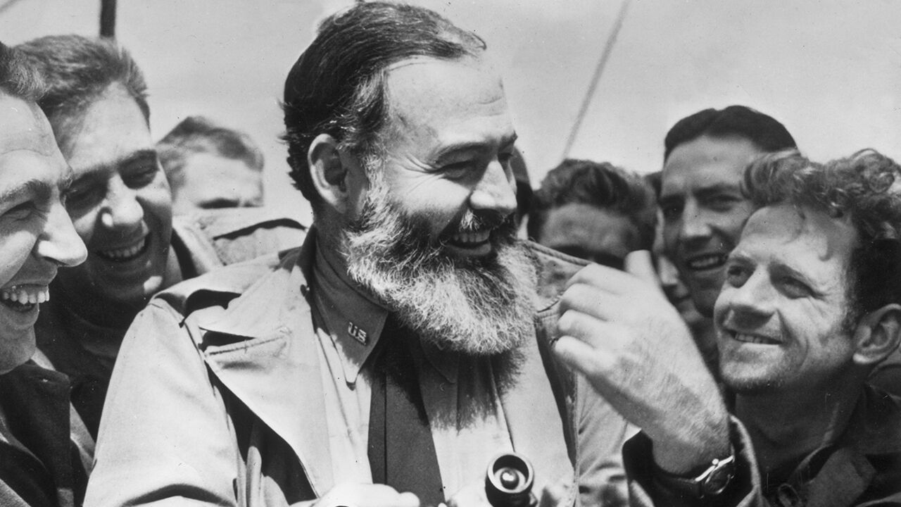 Ernest Hemingway travelling with US soldiers, in his capacity as war correspondent, on their way to Normandy for the D-Day landings