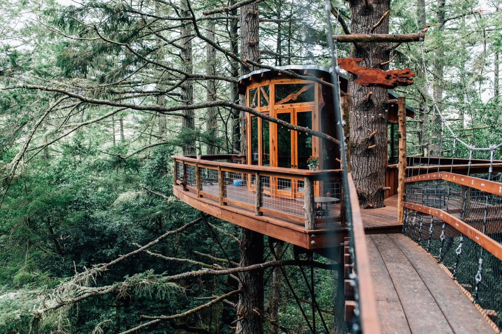 A couple at a treehouse in the woods