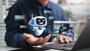 illustration of smiling robot and other AI graphics, with picture of man working at laptop in background