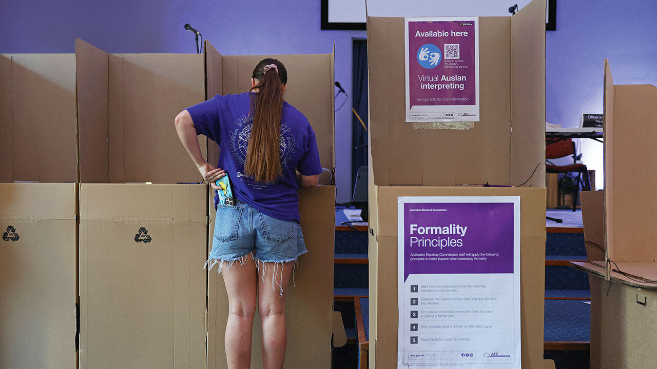 A young woman votes at a pre-polling centre in Sydney