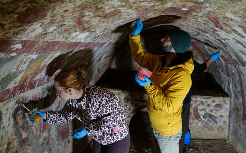 Scientists explore a tomb