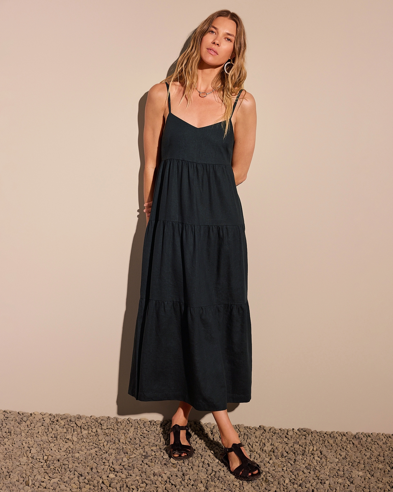 The Kathleen Dress is an effortless black maxi designed to go anywhere. With adjustable straps and a flattering empire waist, it's the perfect piece to wear on its own or layered year-round.