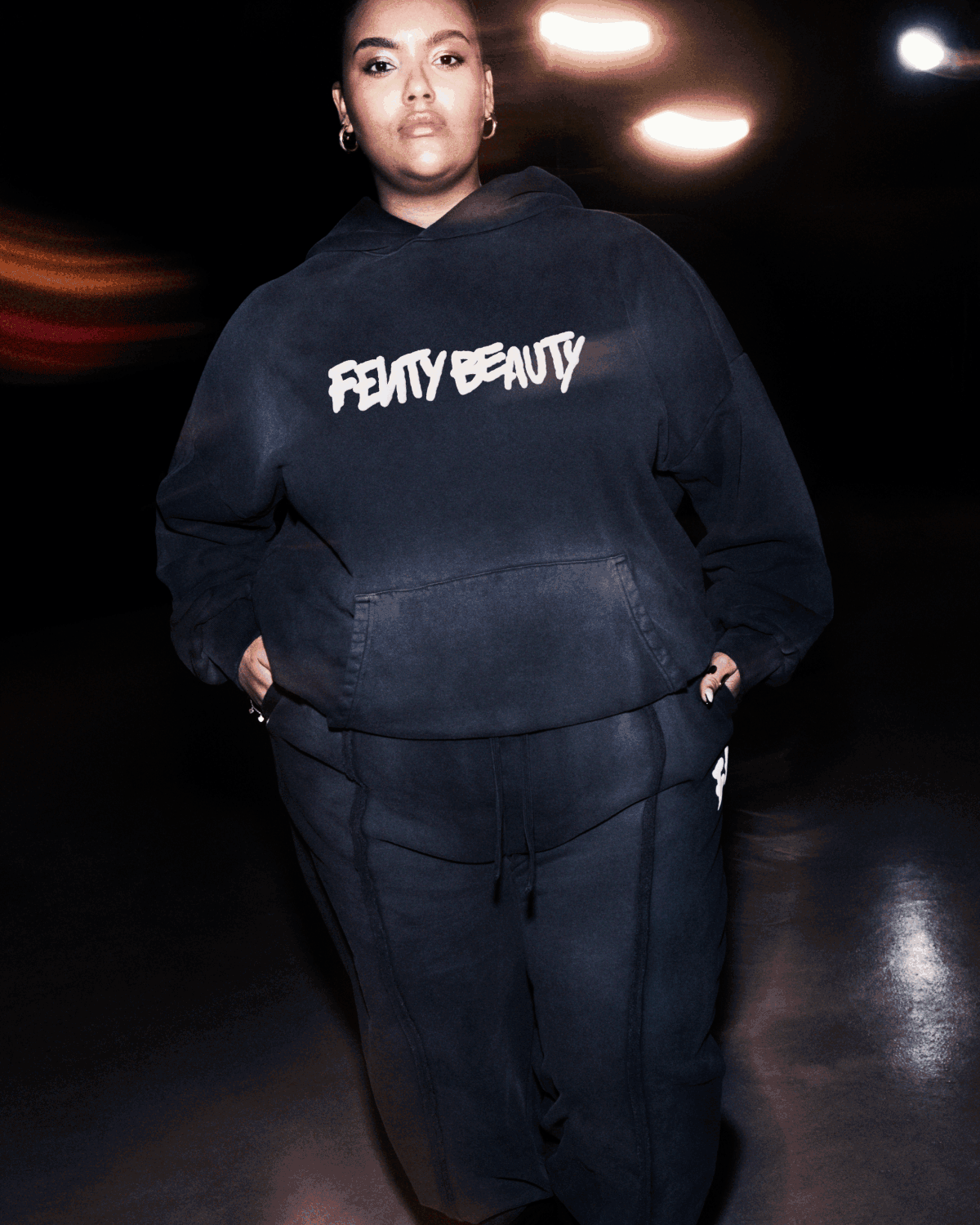 Models wearing Fenty Beauty oversized hoodie + sweatpants