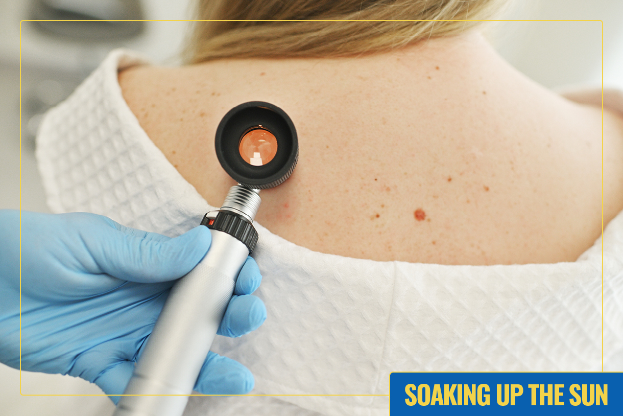A medical instrument is placed against a patient's back.