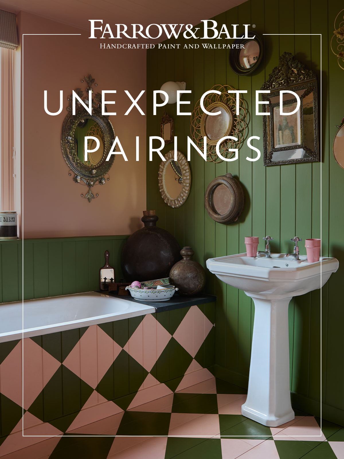 We’re ready for a very stylish bathtime in this bathroom, with its combination of vivid, fresh green and deep, dusty pink. The green wall is home to a collection of vintage mirrors with a variety of ornate frames, but the most ornate one is saved for the pink wall, in a space of its own. The pink tone is carried through to two beakers sitting on the sink.