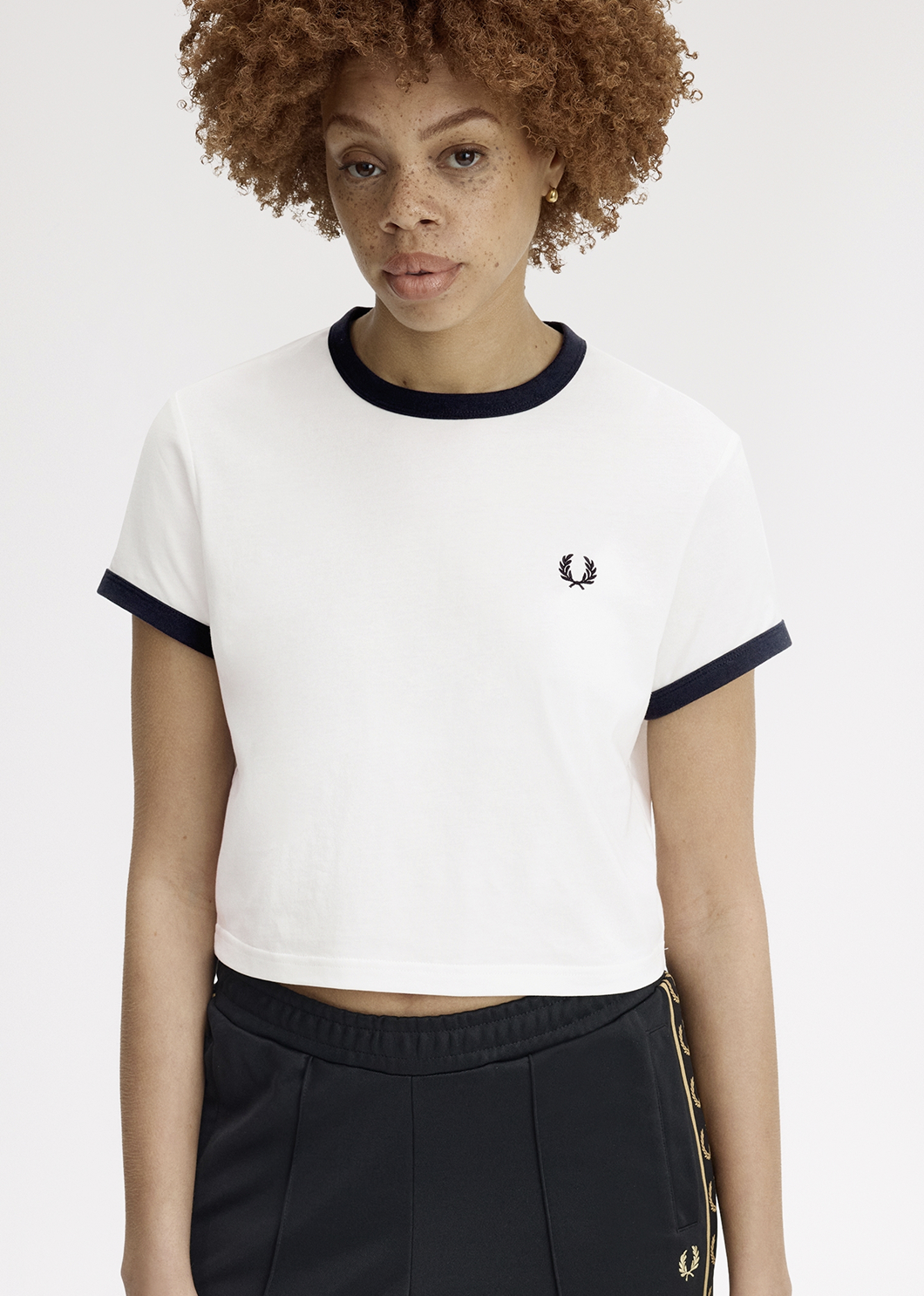 Female model wearing a Fred Perry Cropped Ringer T-Shirt in White