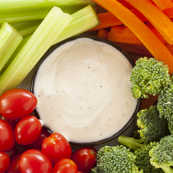 Vegan Creamy ranch dip surrounded by fresh cut veggies