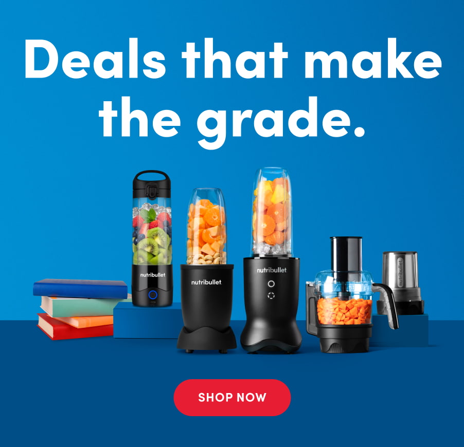 A vibrant blue background showcases five different nutribullet blenders and food processors, some filled with colorful chopped fruits and vegetables. The appliances are arranged alongside a stack of books