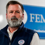 Gregg Phillips, wearing a vest that has a patch with a seal that reads, “U.S. Department of Homeland Security.”