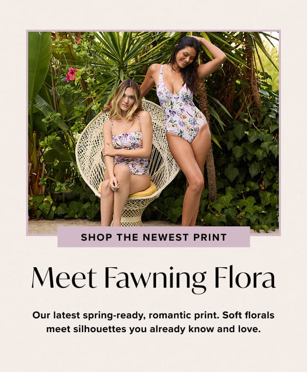 an image of two women in swimsuits sitting on a chair
