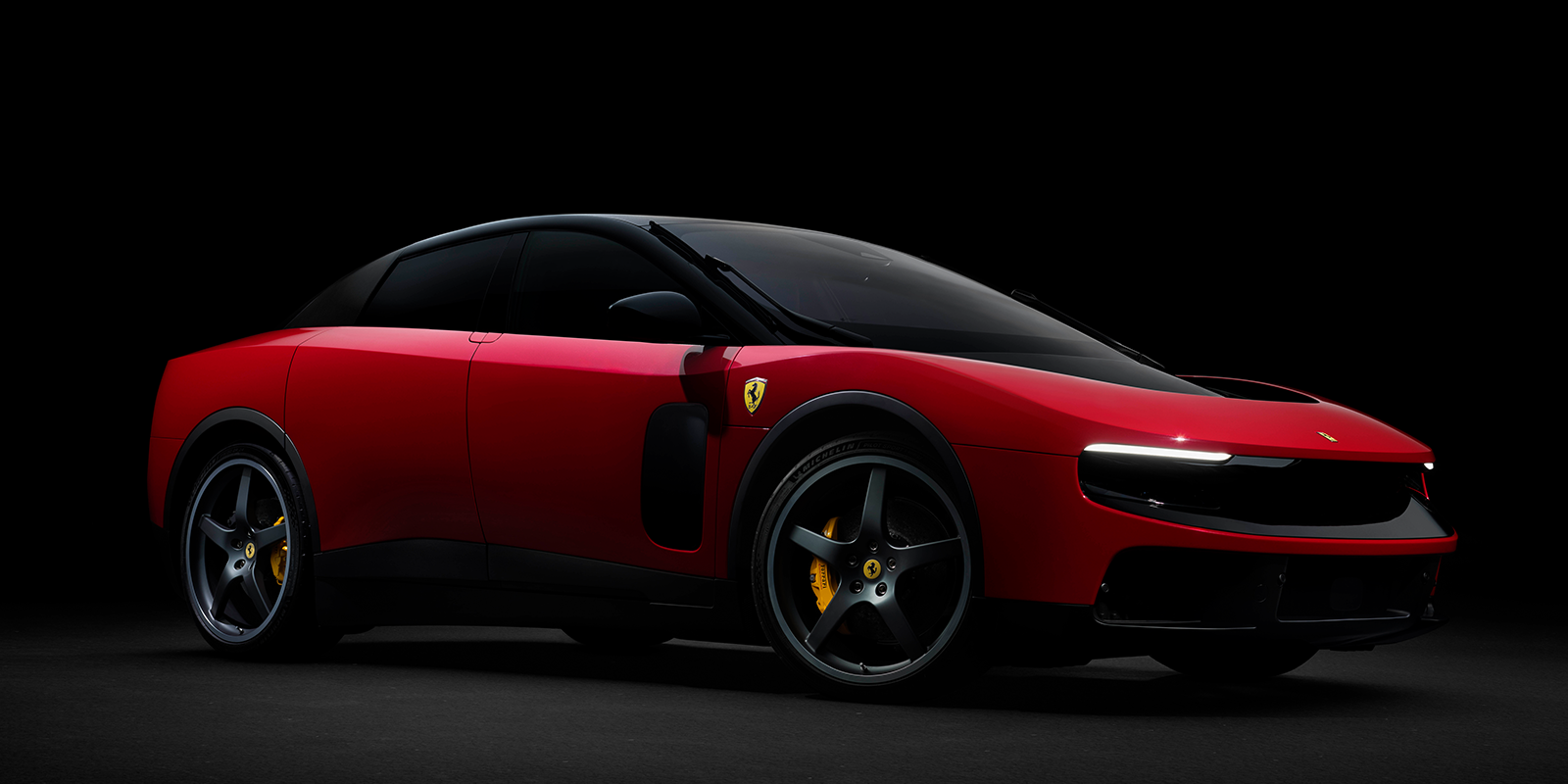 The brand-new Ferrari Luce in a deep red, parked against a dark faded background linking to a car news article on Top Gear's website.