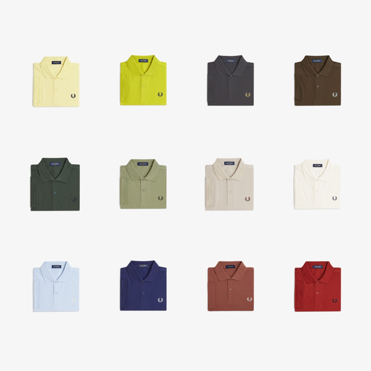 a selection of one-colour Fred Perry polos in different colours