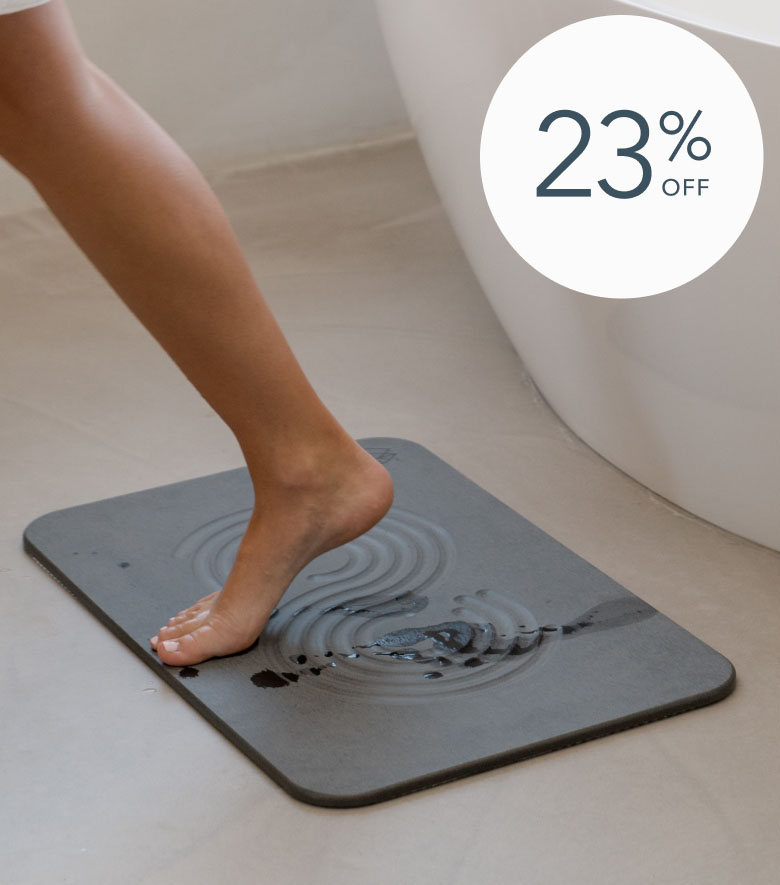 Foot stepping on wet bath mat, 23% off.