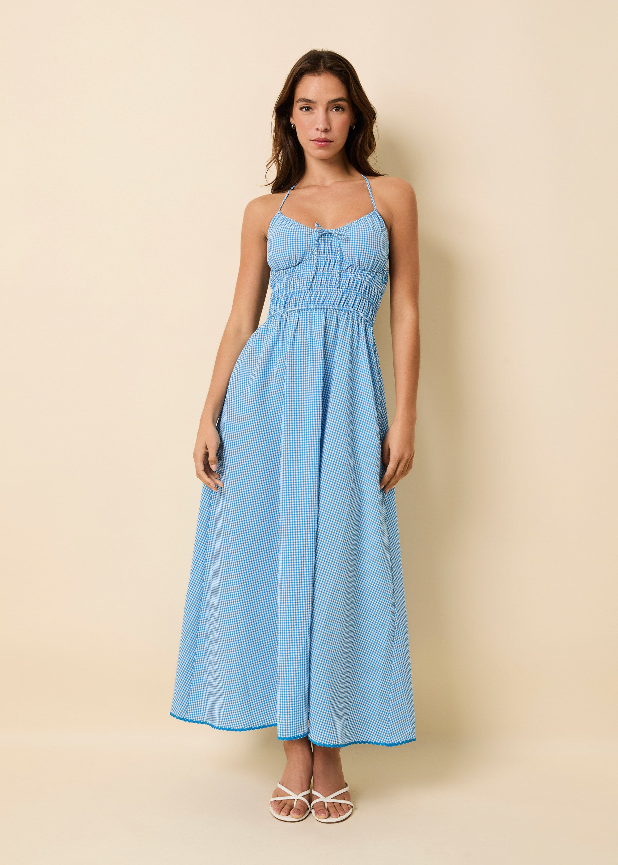 Woman in light blue long dress with ruched bodice detailing