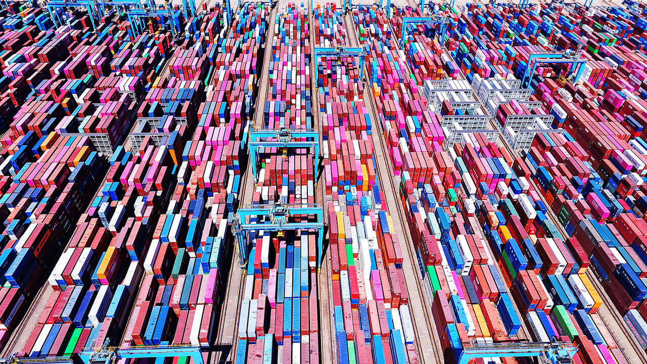 Aerial view of containers for export sitting stacked at Qingdao Port, China
