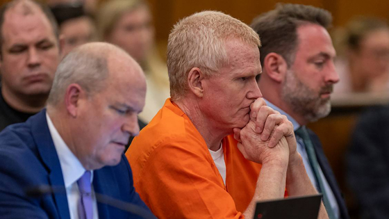 People in a courtroom. 