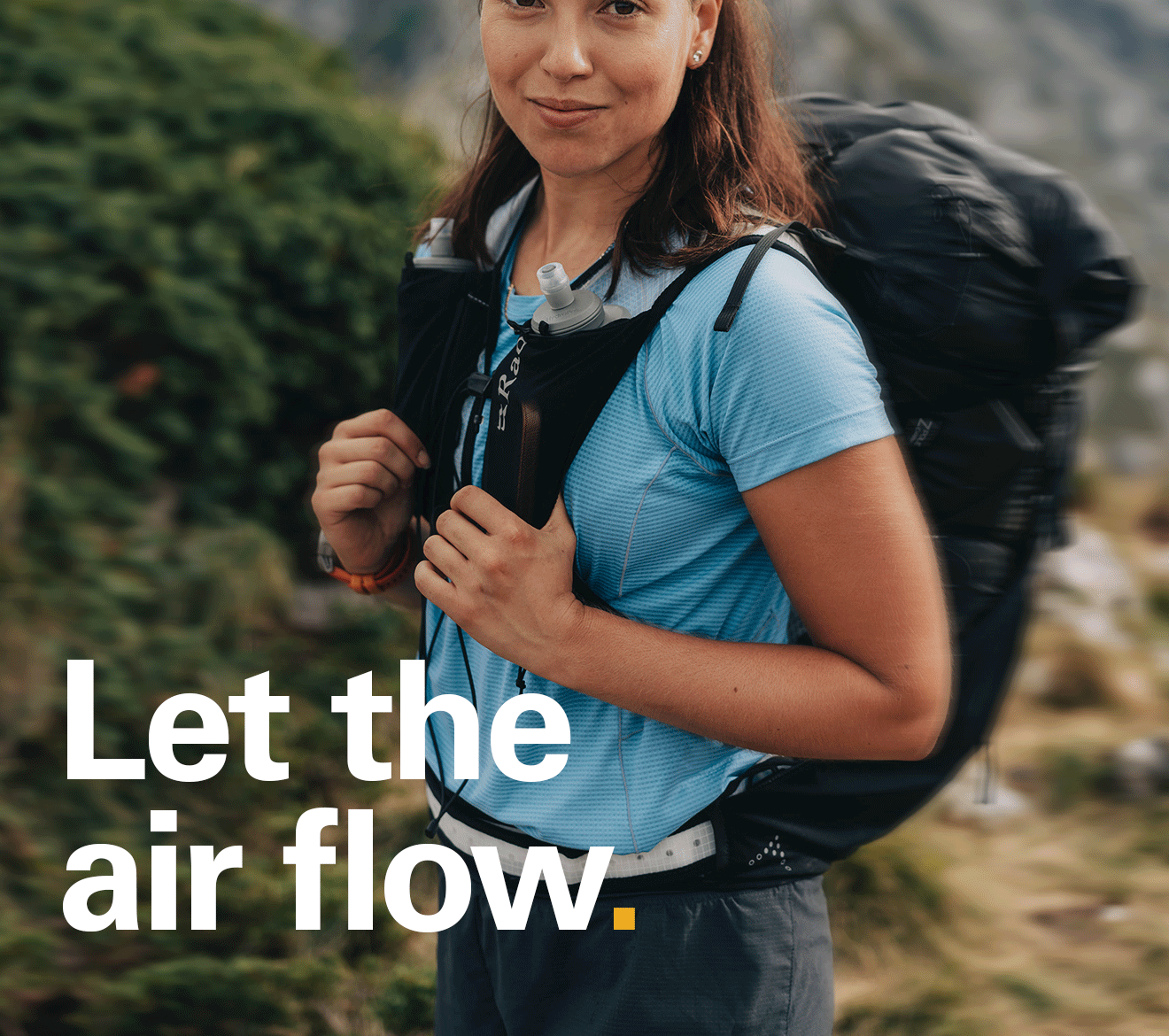 'Let the air flow.' Text on the image of a women stood in the hills wearing a Rab Sonic Tee.