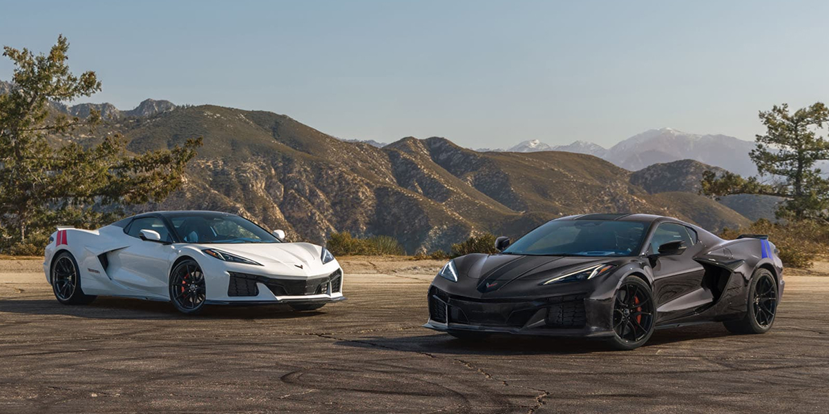2027 Corvette Grand Sport and Grand Sport X parked in front of a rocky terrain.