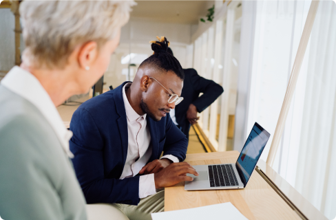 Photo-of-coworkers-focused-on-laptop-in-office