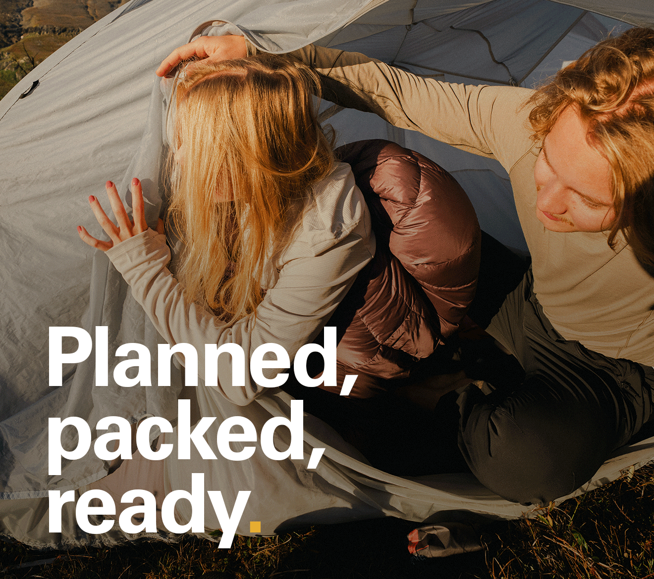 'Planned, packed, ready.' Text over the image of two people in a tent on a bright sunny morning.
