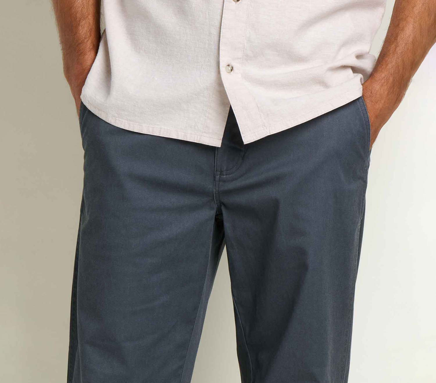 an image of a man in a white shirt and blue mission ridge pants