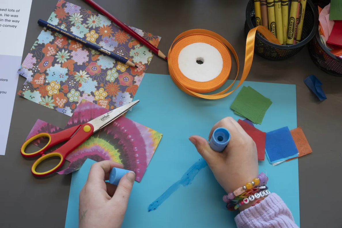 hands crafting with art supplies