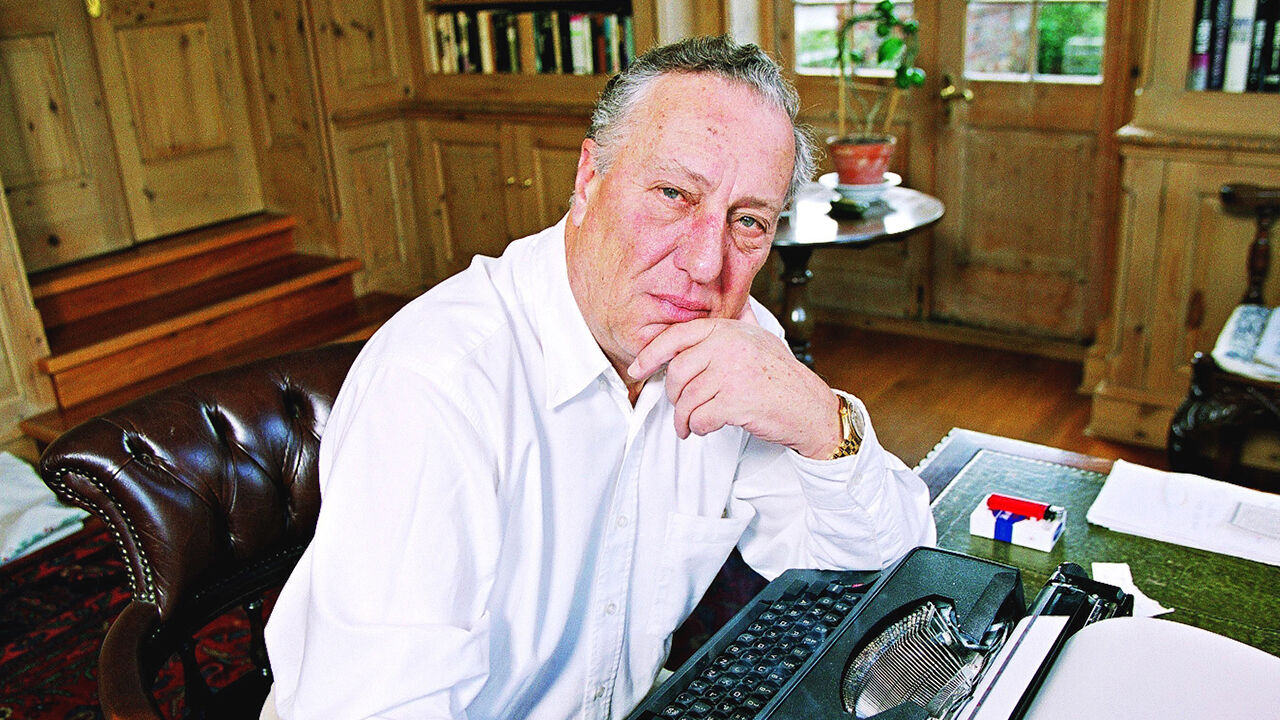 Frederick Forsyth sits at his typewriter at home 