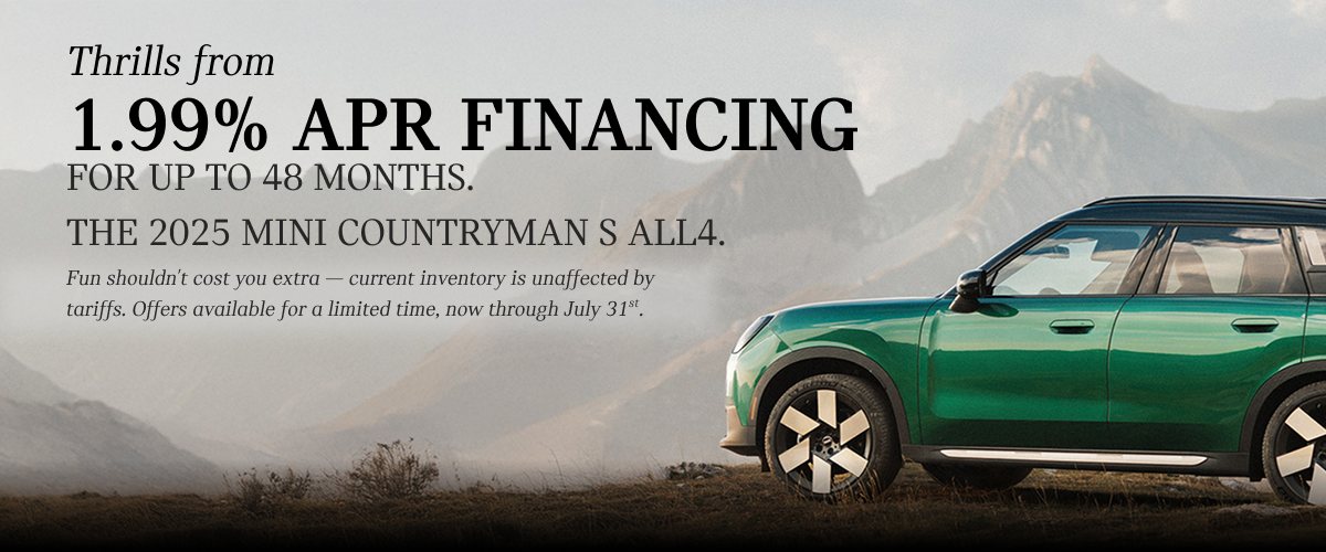 A green Countryman with a mountainous background