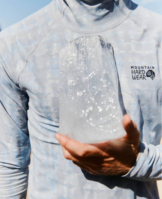 A man wearing the Crater Lake™ Hoody holding ice.
