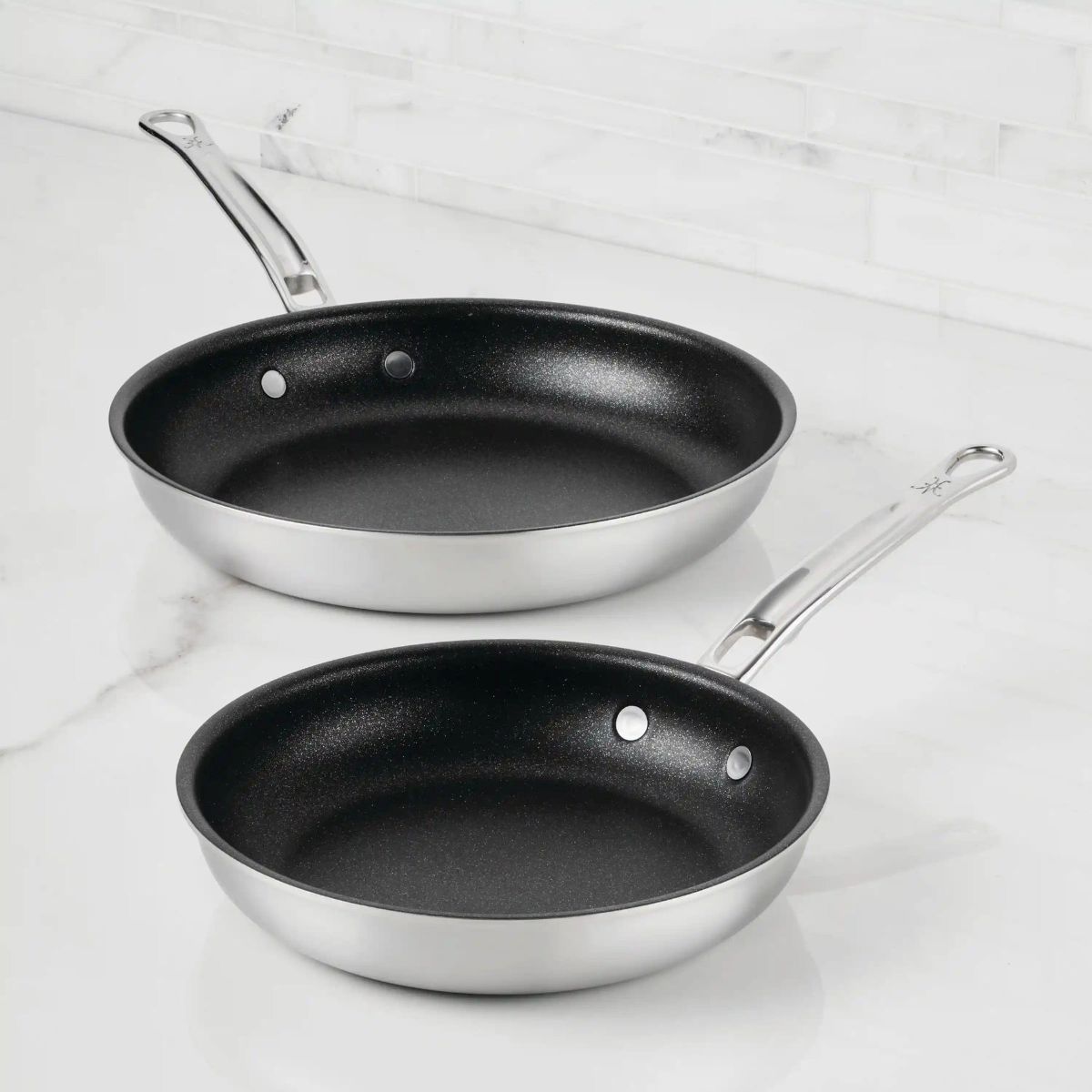 IMG: Commercial Clad Stainless Steel TITUM® Nonstick Skillets on marble countertop