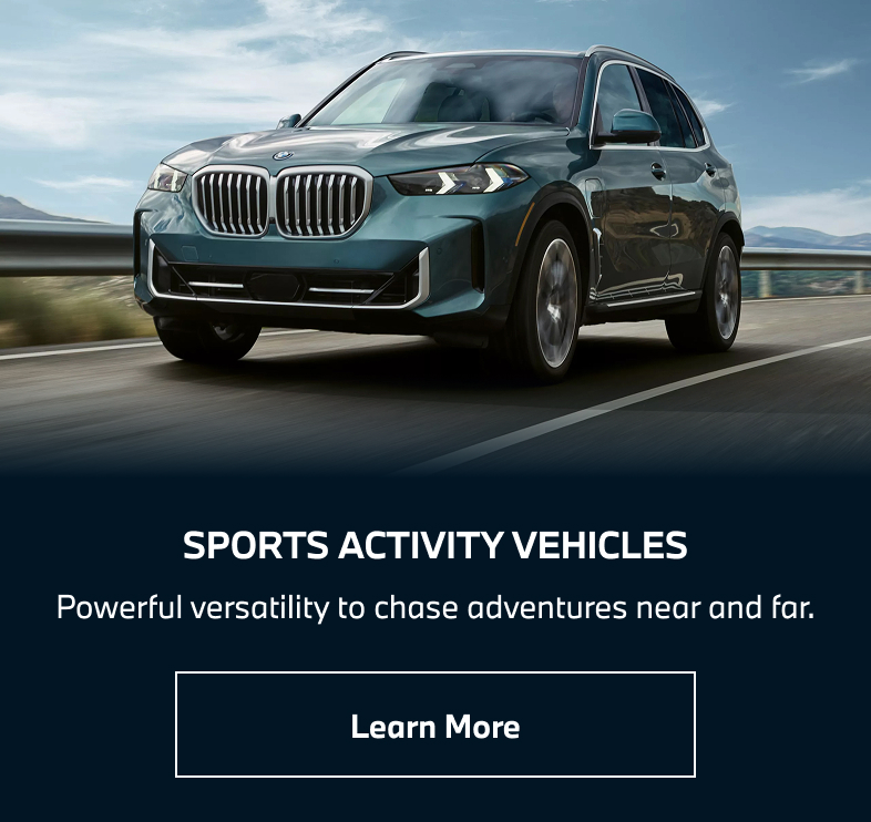 BMW Sports Activity Vehicle driving down the road. Learn more.