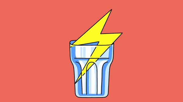 A glass cup containing a graphic lighting bolt