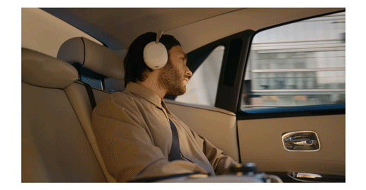 Animated GIF of a man in a luxury car listening to music with The 1000X Collection headphones.