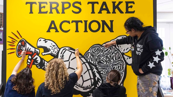 four students paint 