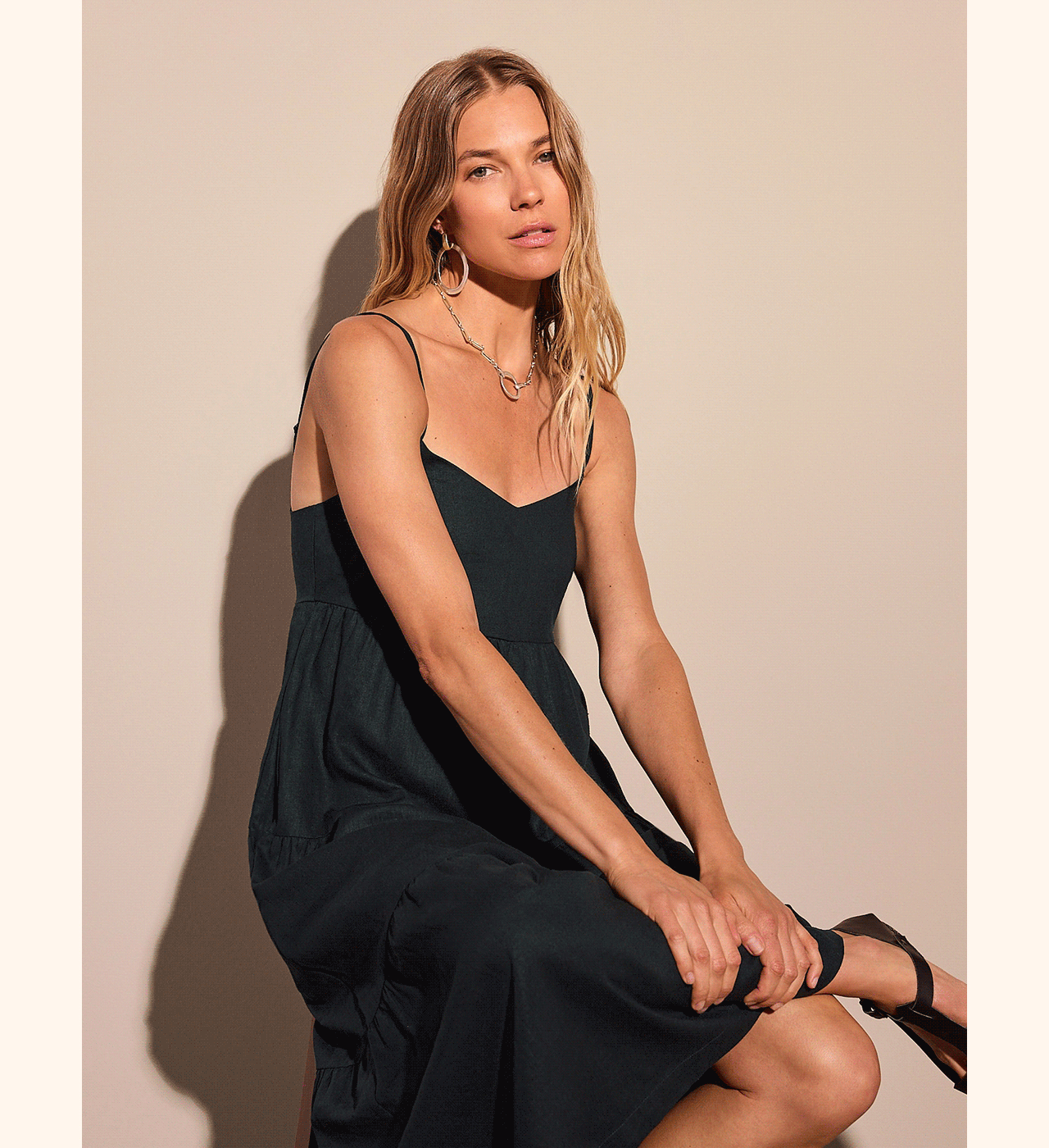 The Kathleen Dress is an effortless black and fuchsia maxi designed to go anywhere. With adjustable straps and a flattering empire waist, it's the perfect piece to wear on its own or layered year-round.