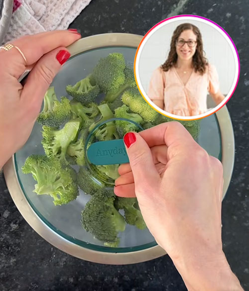 Fresh broccoli florets being steamed in an Anyday Deep Dish with a glass lid; a safe and easy method to cook in the microwave without plastic.