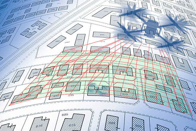 A drawing of a drone shadow flying over a series of buildings, connected by red lines.