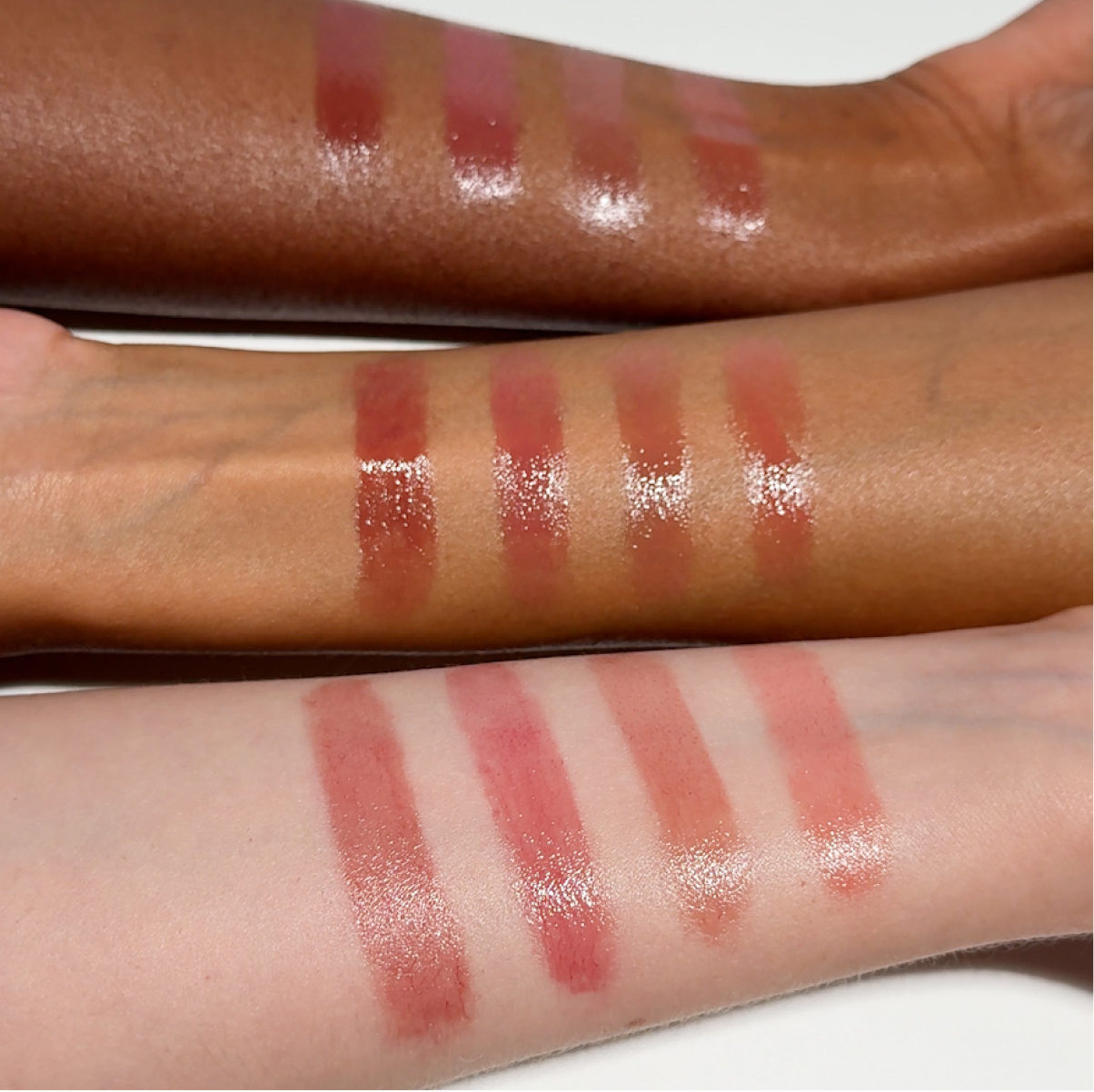 Swatches of Futurelipstick Deluxe Shine on arms