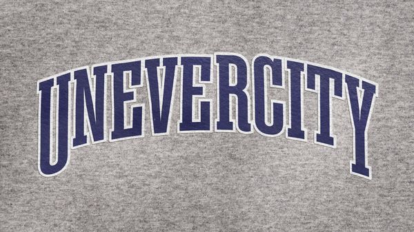 School jersey with UNEVERCITY” on it. 
